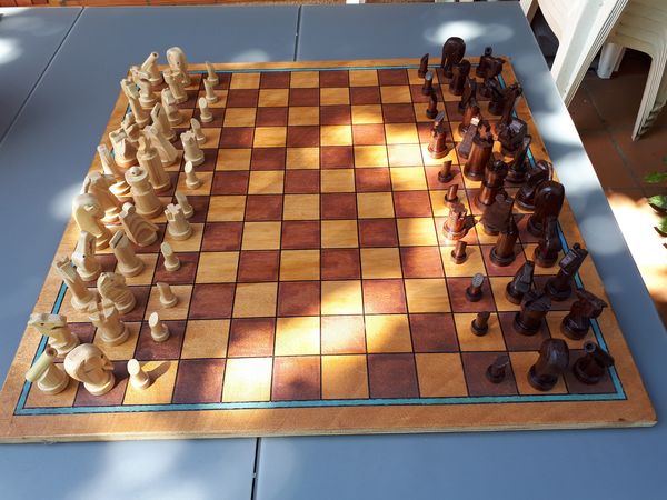 A photograph of a Zanzibar-S board and pieces